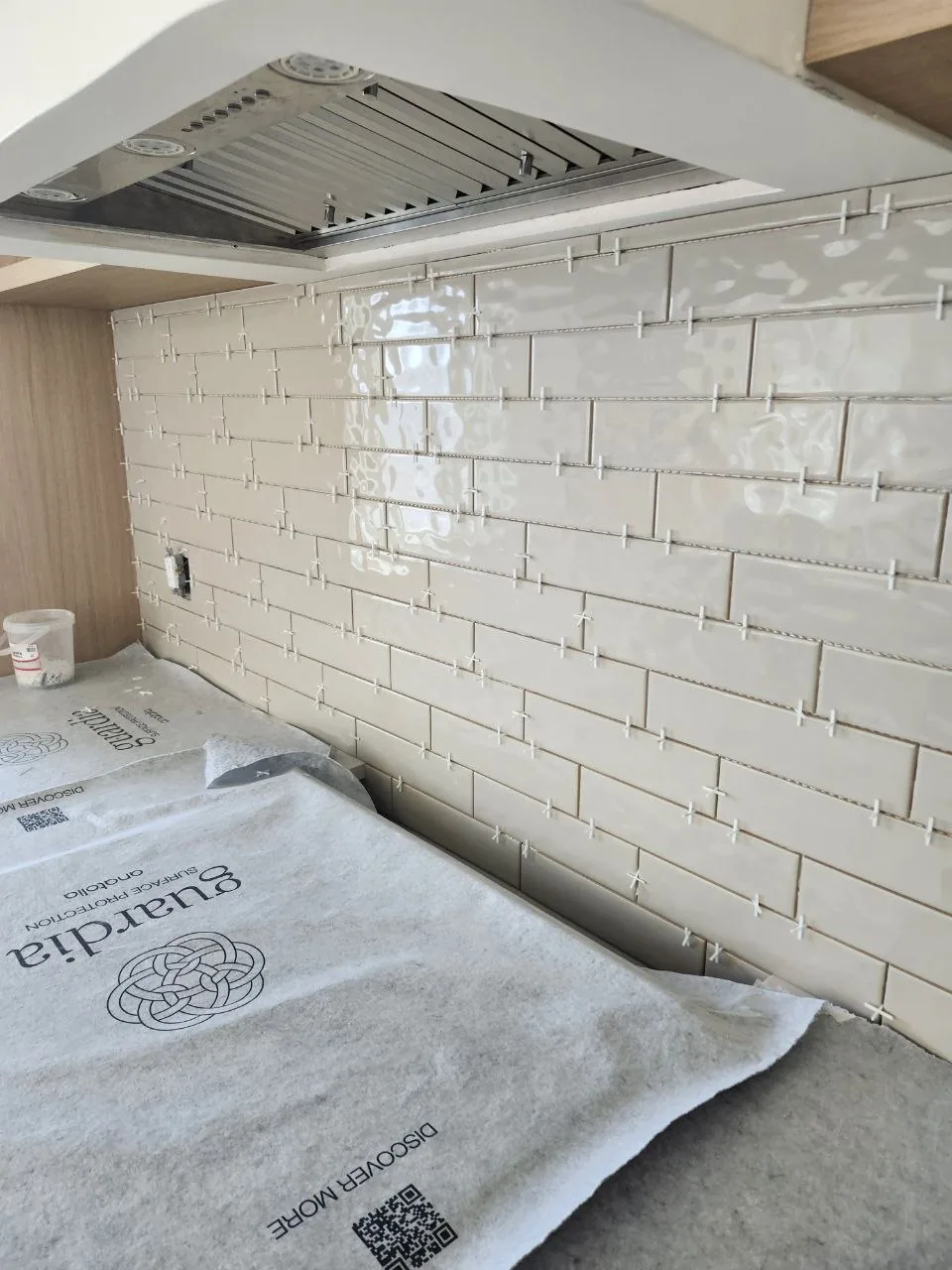 Finished kitchen with handmade-tile backsplash and oak cabinetry