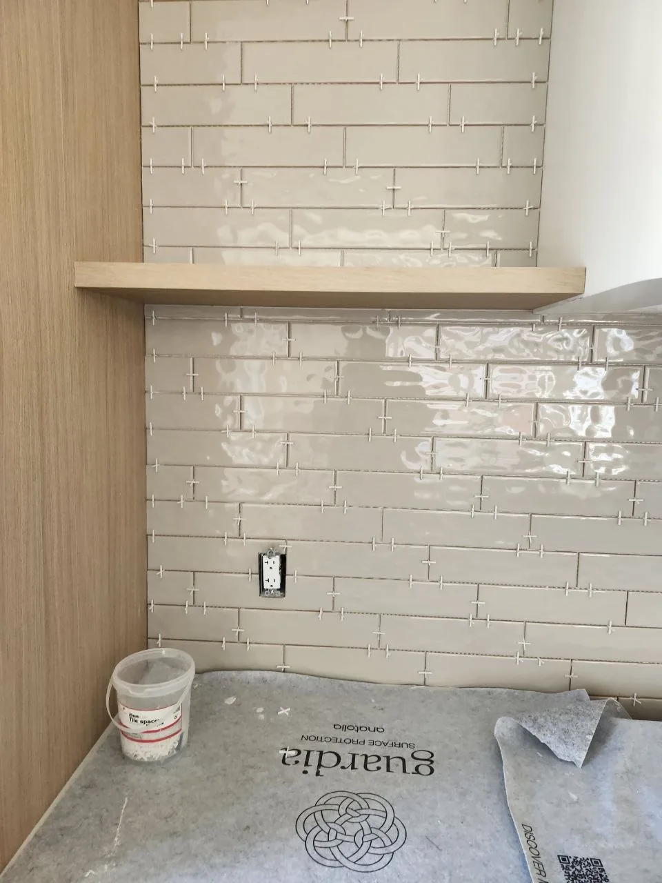 Backsplash going in around the shelf
