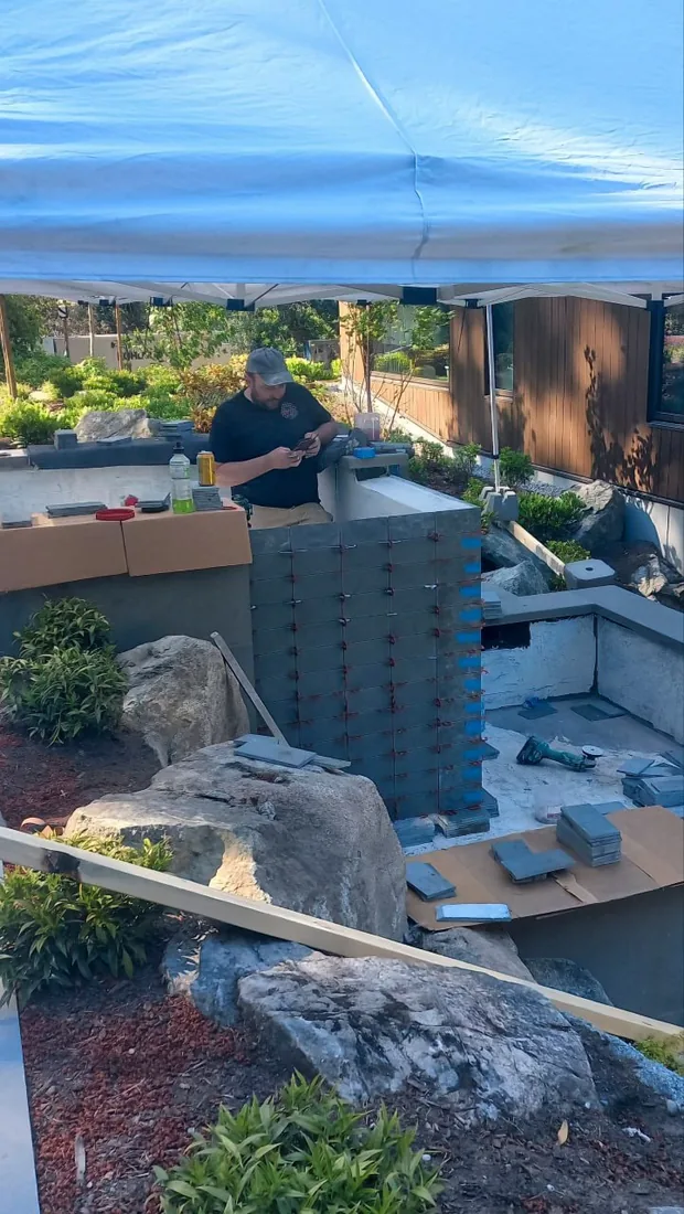 NovoTile installer on site during a stone tiling project in Greater Victoria