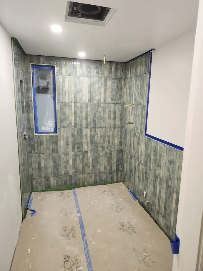 Walls tiled, floor protected