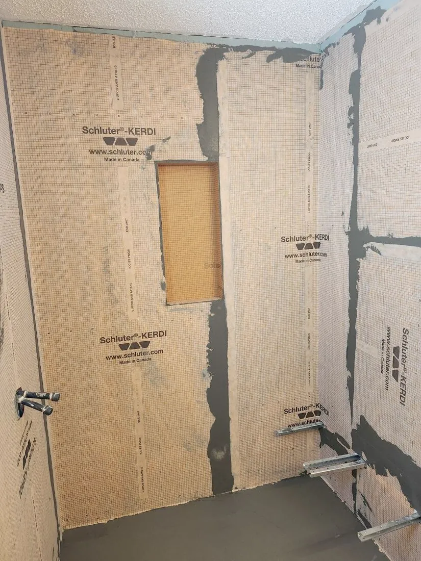 Walls waterproofed, niche framed