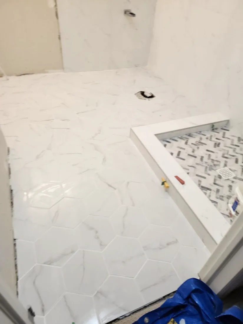 Hex marble-look floor going in