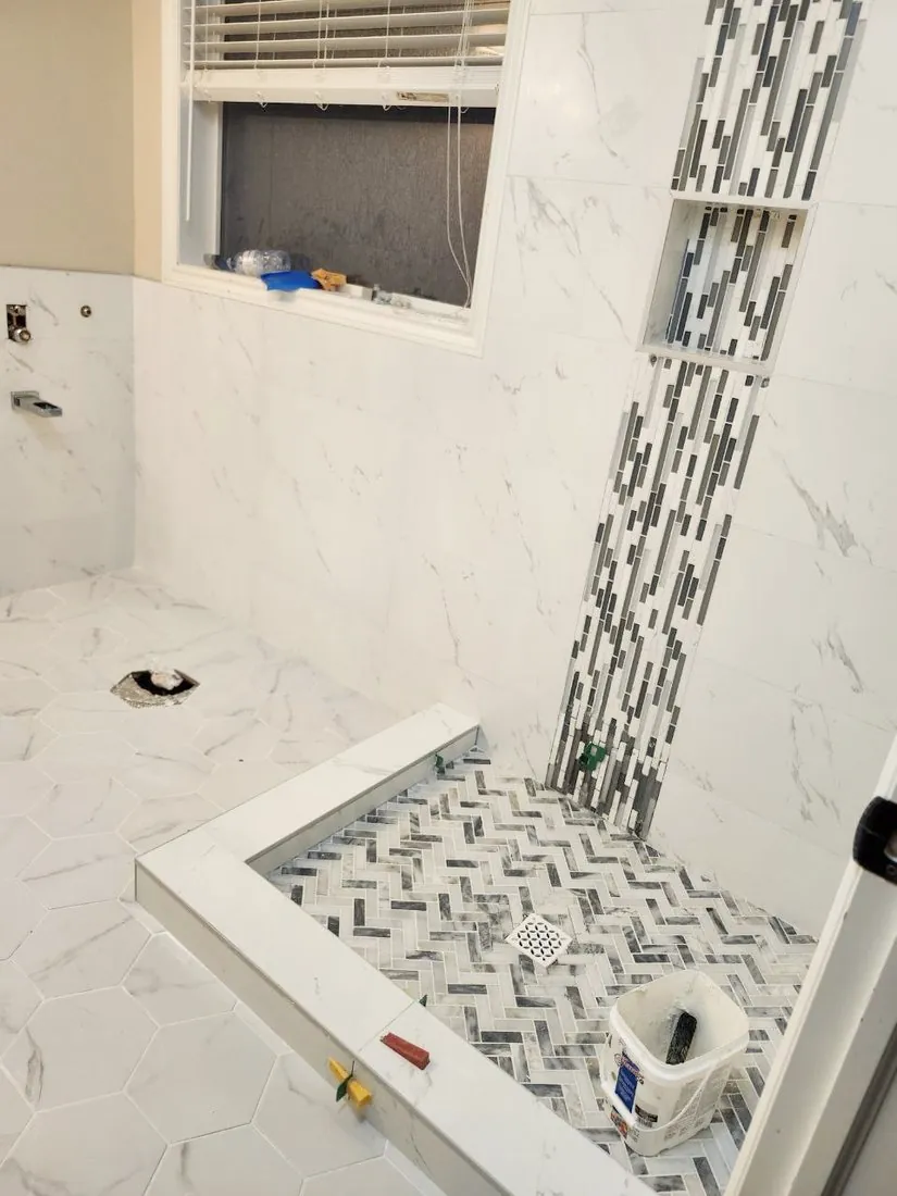 Herringbone shower floor & accent strip