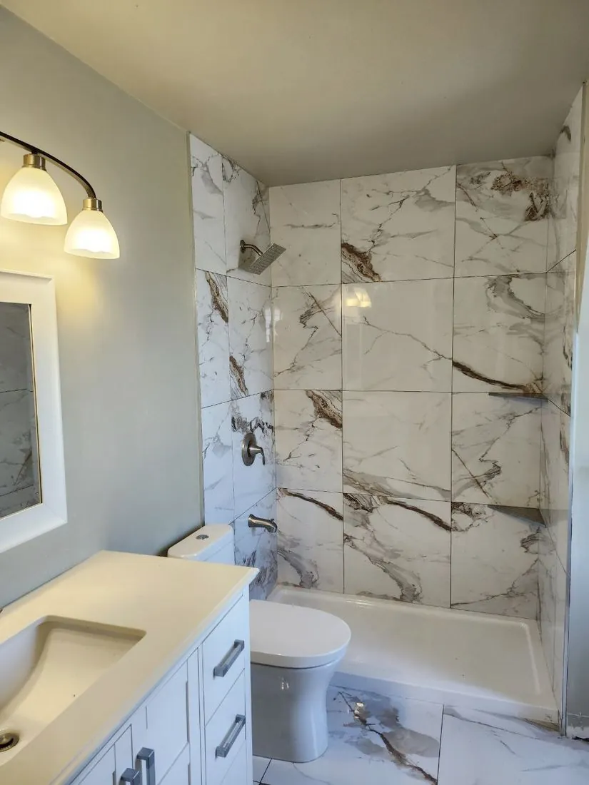 Vanity, shower & marble floor