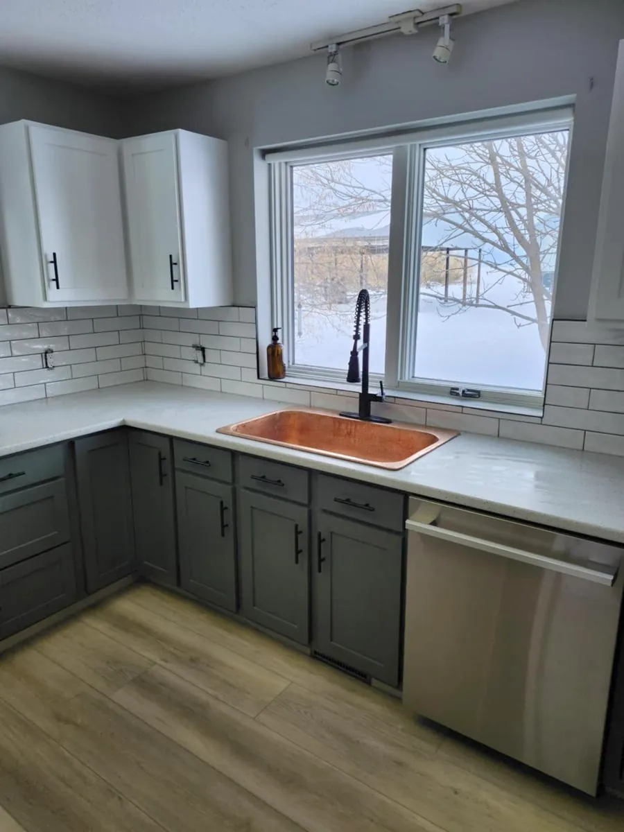 Two-tone kitchen with copper sink