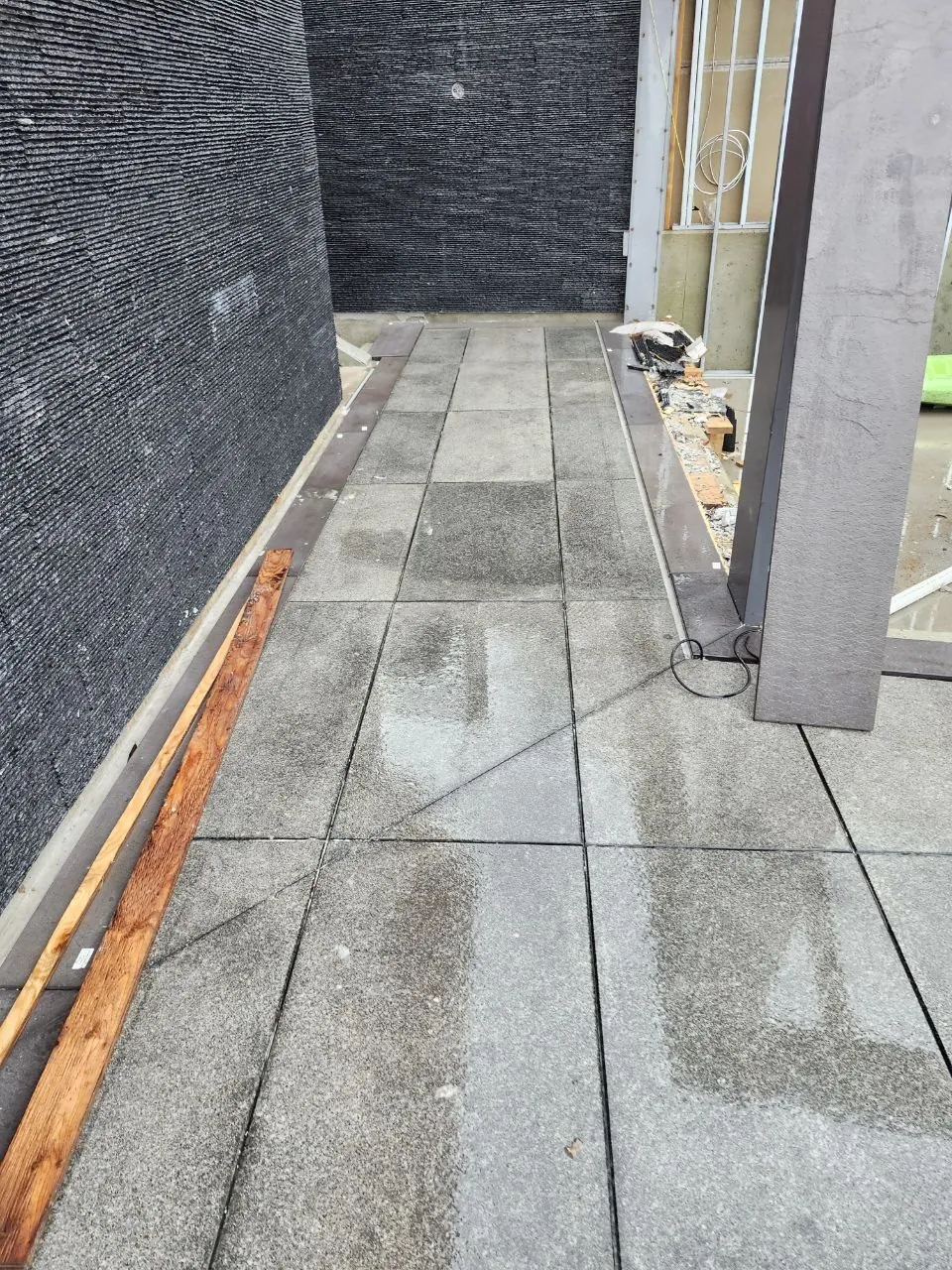 Granite walkway along the wall
