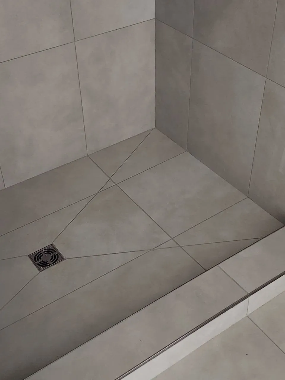 Pinwheel-cut shower floor