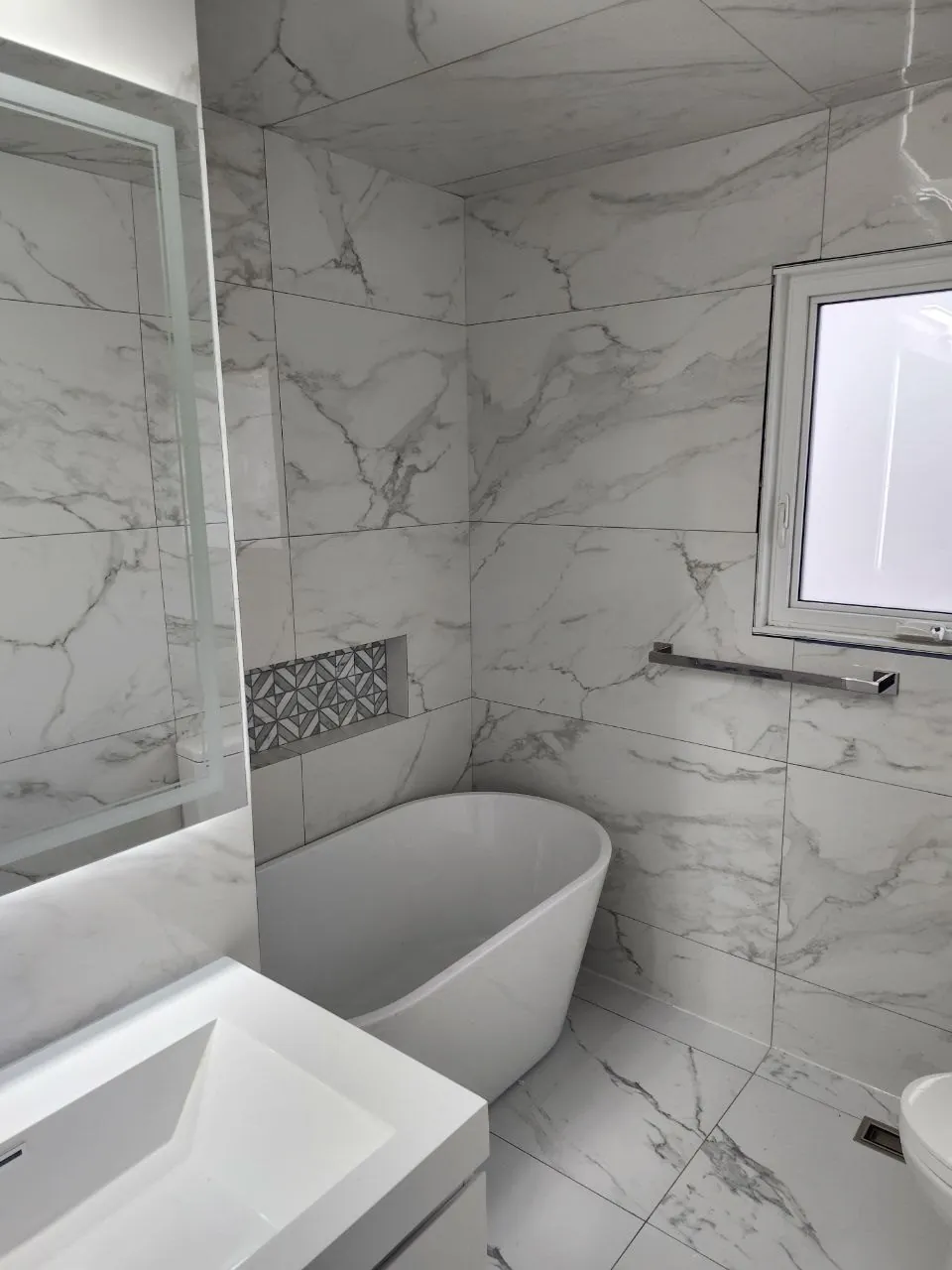 Finished marble-look bathroom